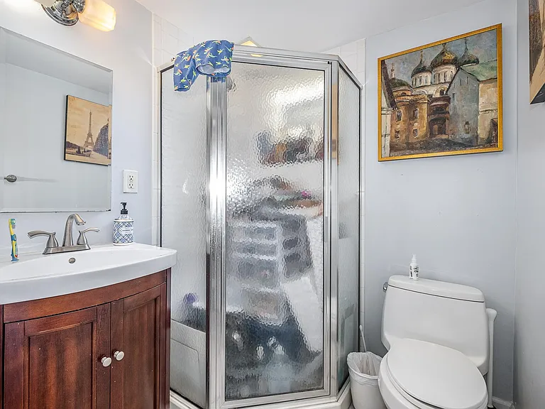 Full bath on first floor. Current tenant stored some things in the shower. Please pardon the mess
