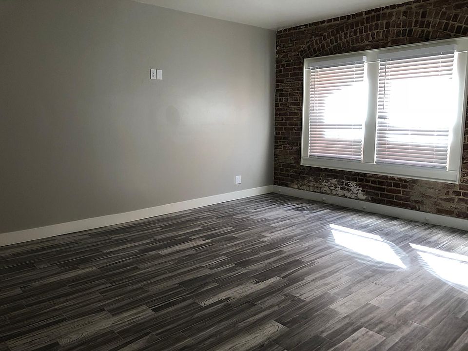 Original exposed brick wall on entire side