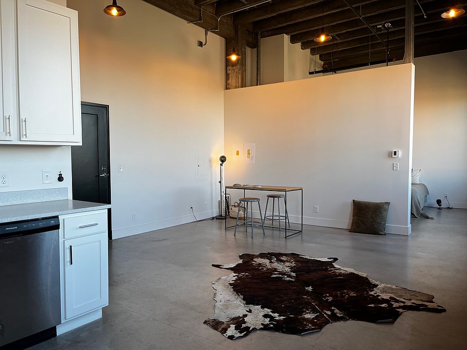 Living area (view from kitchen with bedroom in background)