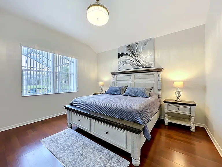 Primary Bedroom with View to the Pool