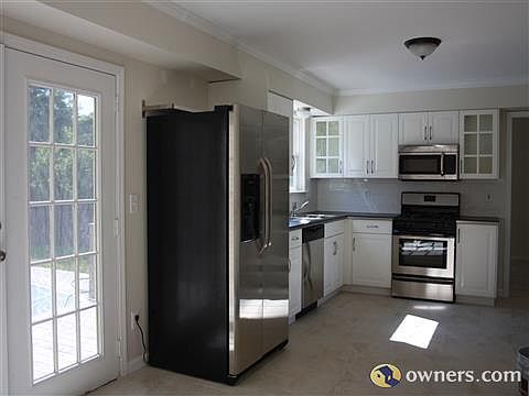 Modern White kitchen with Modern Stainless Steel Appliances