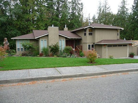 Front of the home from Iowa Drive with Whatcom Falls Park in the back.