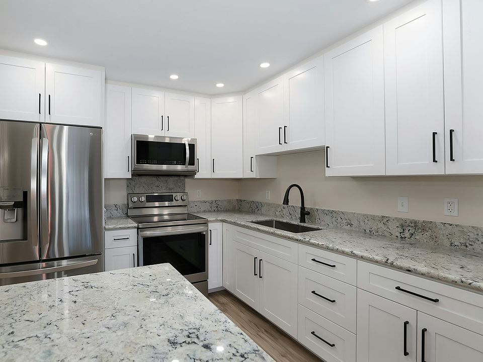 Enjoy this wonderful remodeled kitchen with lots of pantry space, microwave and large "farm sink."