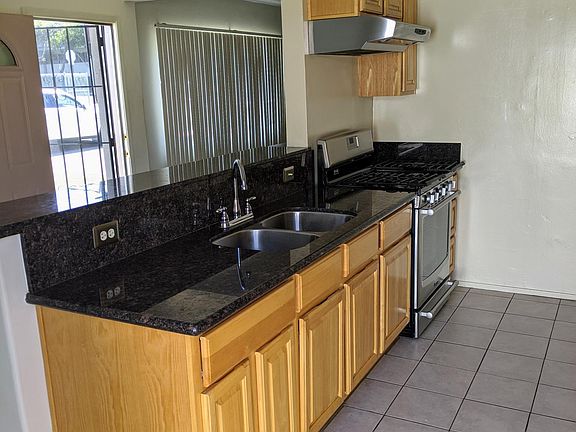 Granite Counterto Newer Cabinetry and Stainless Steel Appliances