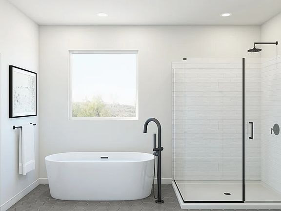 Freestanding tub with glass shower enclosure