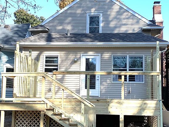 New large deck leading to a garage and off street parking.