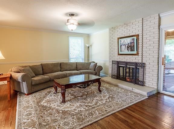 Family room with sliding door to screened in porch