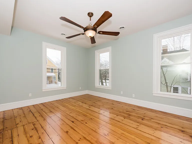 Sun filled Master Bedroom with original hardwood floors