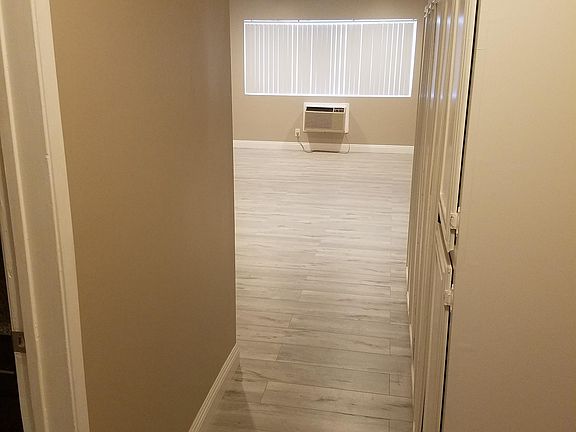 Hall with large clothing & storage closets.