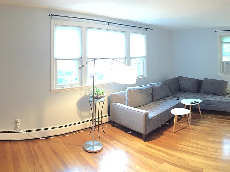Spacious living room with walk in closet and plenty of natural light.