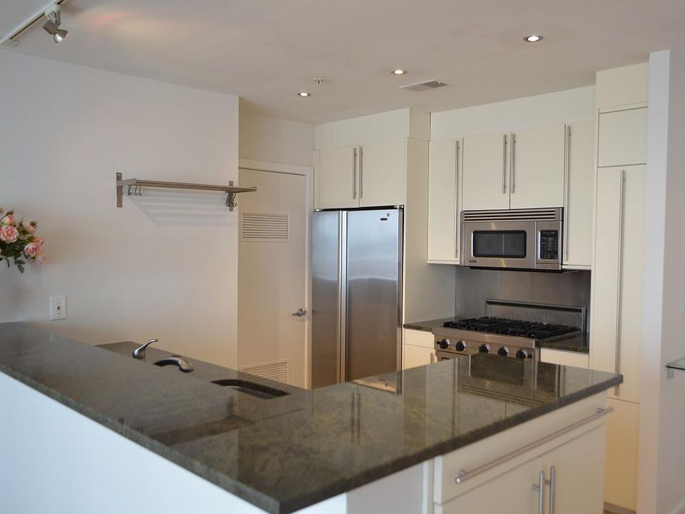 Open layout, gourmet kitchen with Viking appliances and beautiful imported granite counters.
