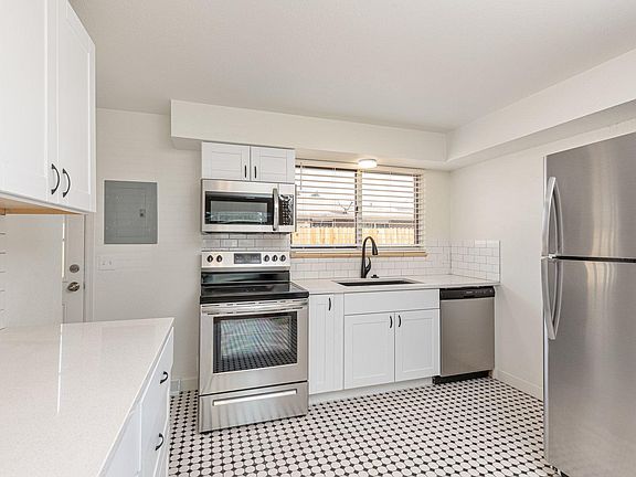 Completely updated kitchen with new cabinets new stainless steel appliances and new quartz countertops