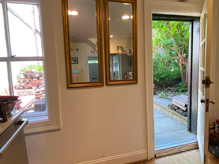Access to back patio, gas grill, yard.