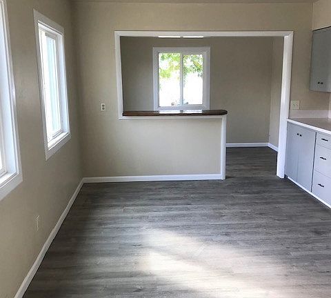 Larger unit- Looking from kitchen towards entry and living room.