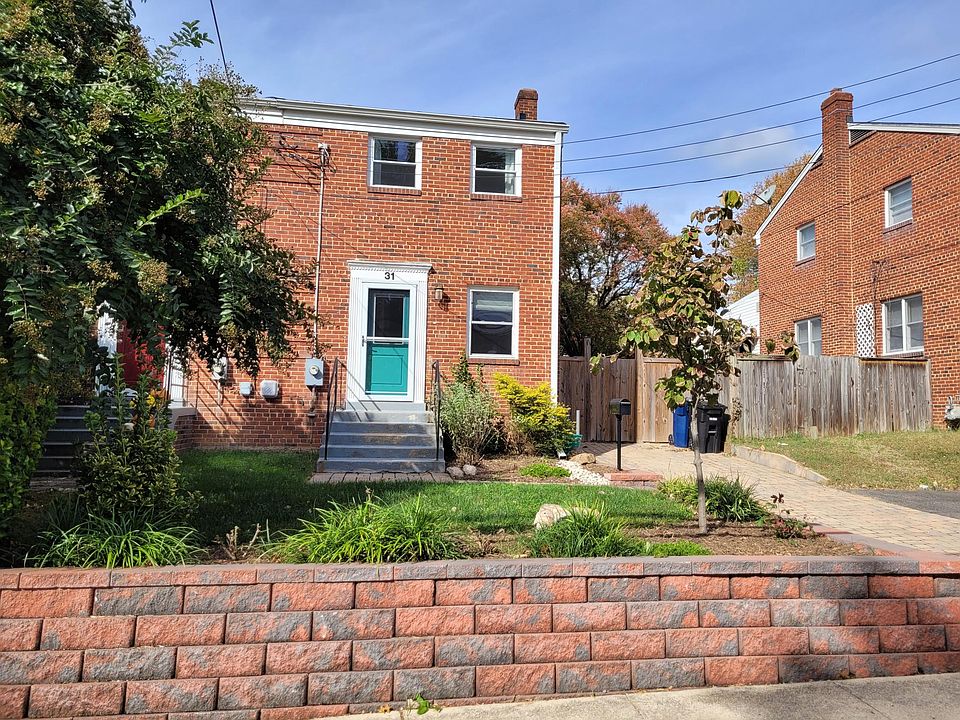 Front of duplex with off-street parking