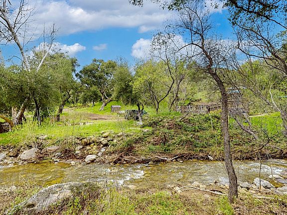 Across from seasonal creek and steps to trail