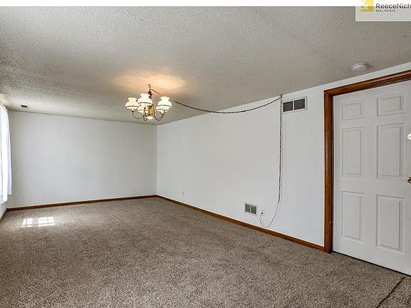 Entry level Rec room. Door goes to Laundry area and garage.