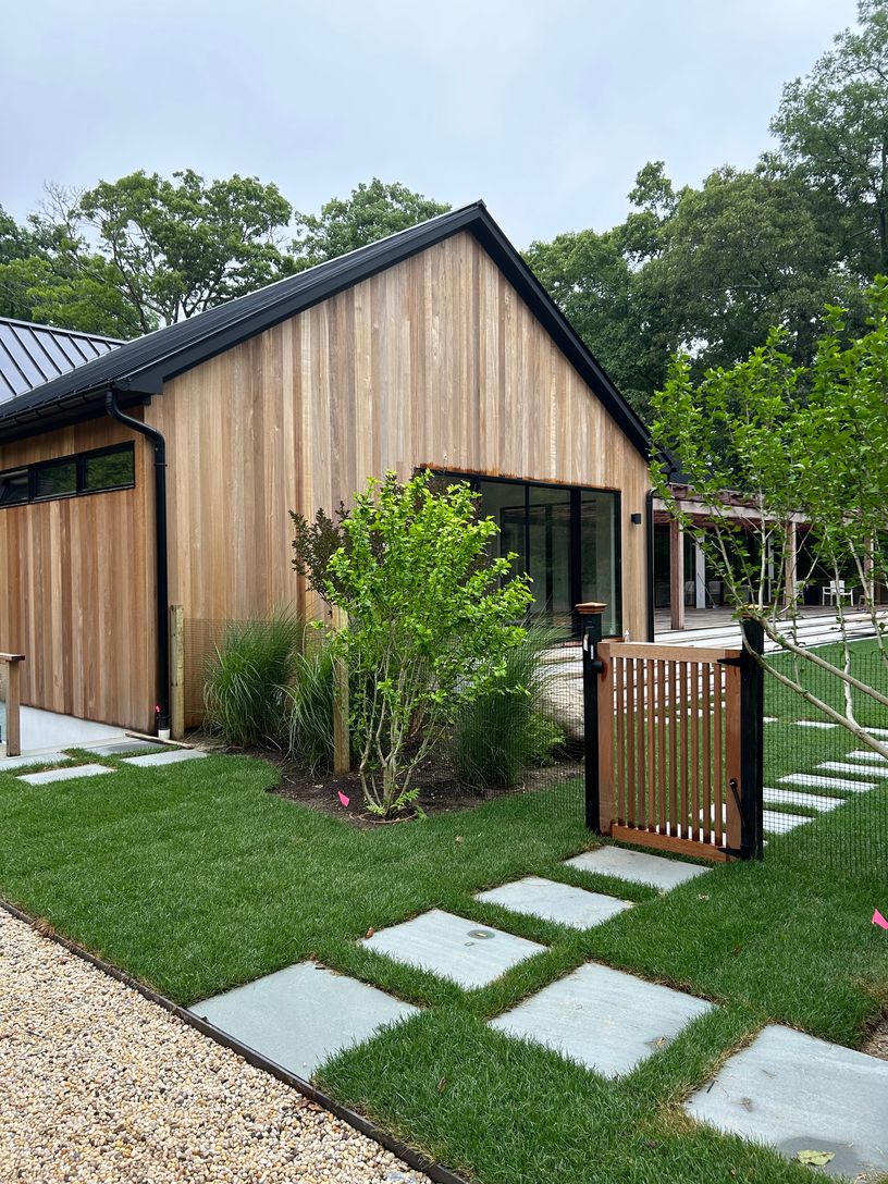  Mature landscaping, primary bedroom with sliding glass doors that open to the pool 