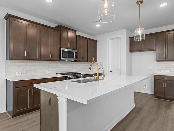 Kitchen. Sample product photo. Actual exterior and interior selections may vary by homesite. Photo m