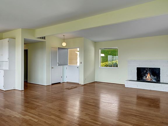 Living room with wood burning fireplace