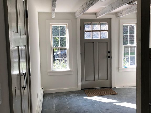 Natural slate tiled foyer with 2 closets