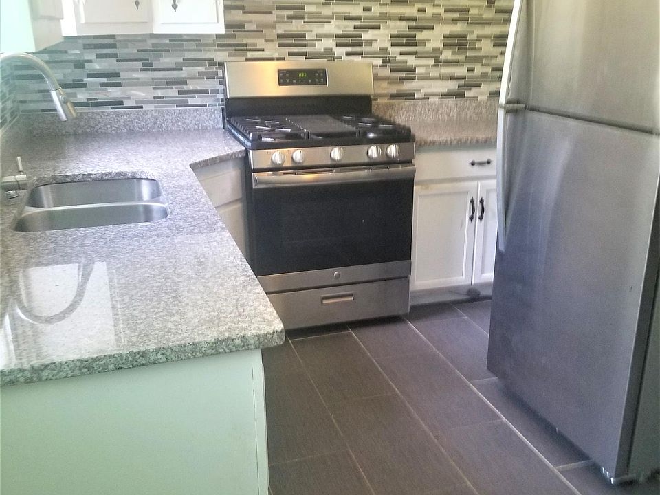 Kitchen with granite counter top and stainless steel applian