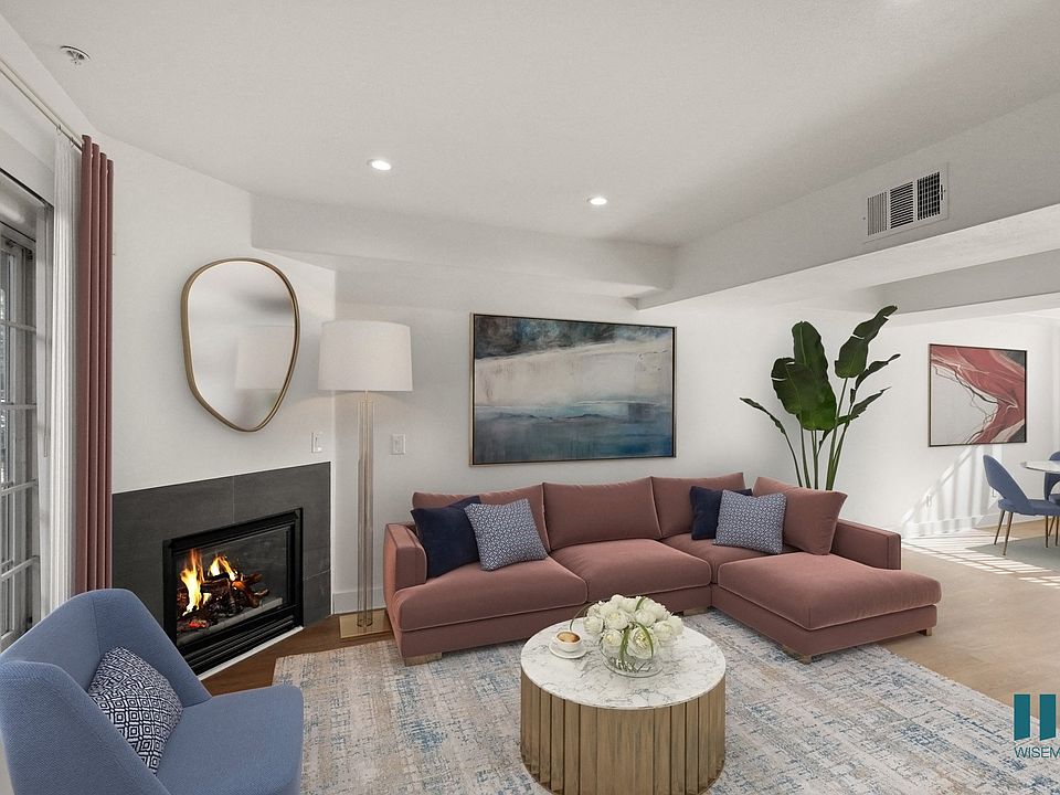 Open-Concept Dining and Living Room with Electric Fireplace and Large-Size Windows