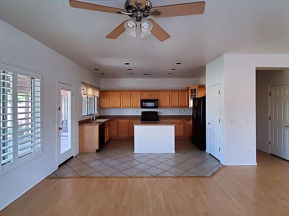 Lots of custom kitchen cabinets with a pantry