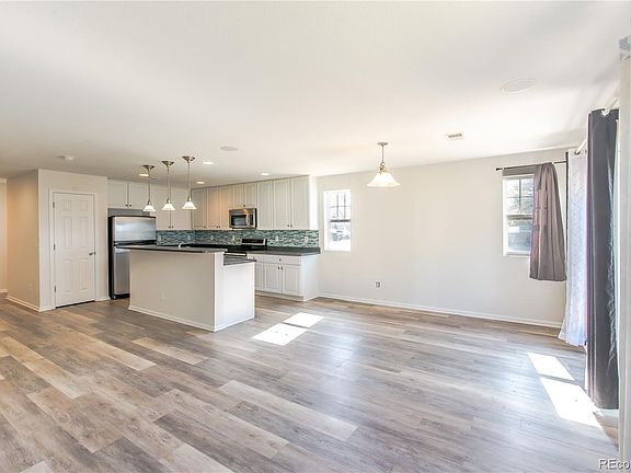 3rd image of 18731 E 58th Avenue #A