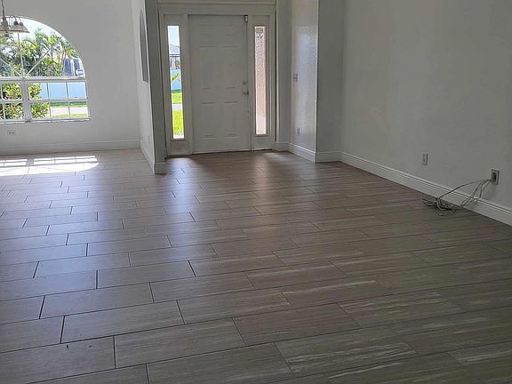 Vaulted ceilings in the light and bright living area.