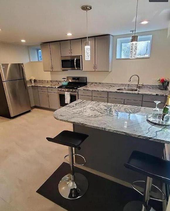 Brand new kitchen, granite counter top and stainless steel appliances.
