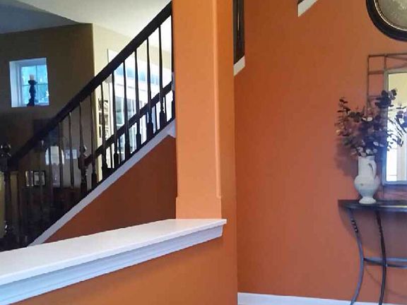 Entry; cherry wood railing stairs