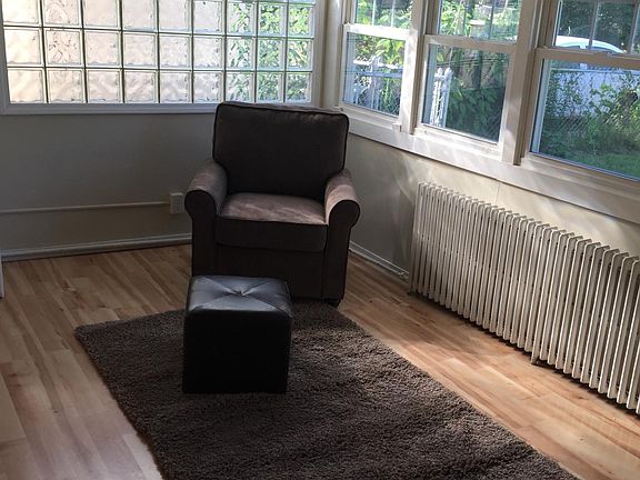 Sunny living room overlooking yard