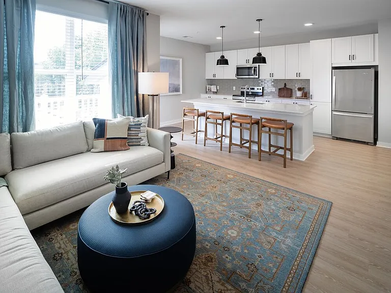 Kitchen, living, and dining area with hard-surface vinyl plank flooring