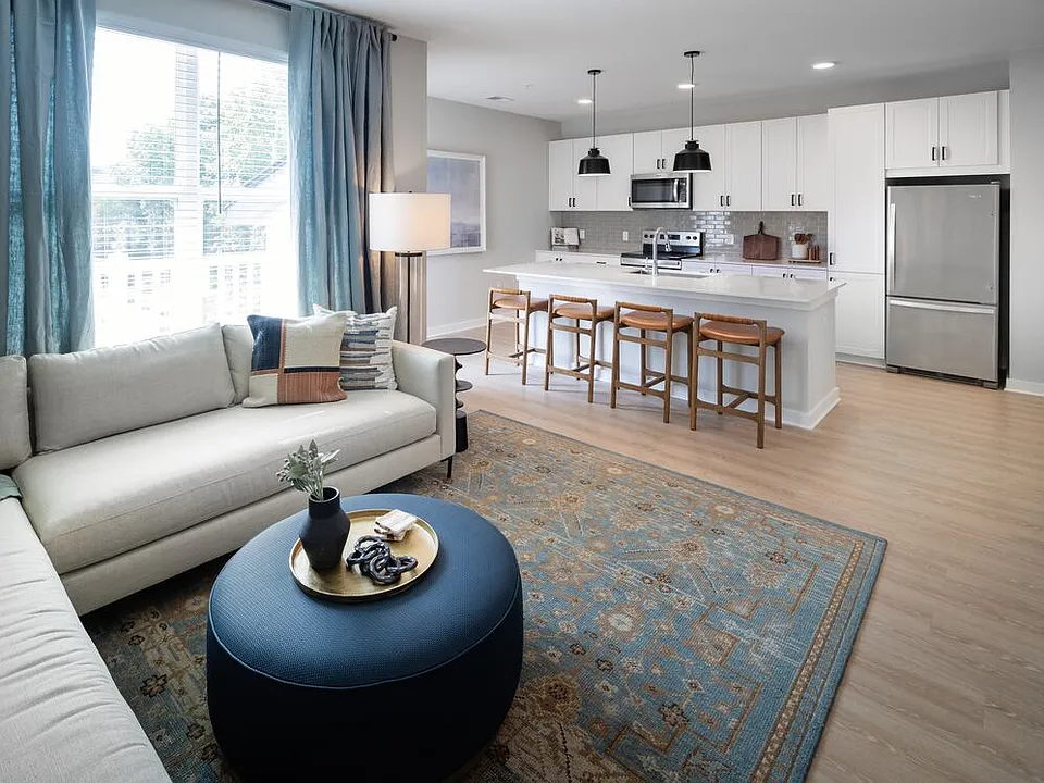 Kitchen, living, and dining area with hard-surface vinyl plank flooring