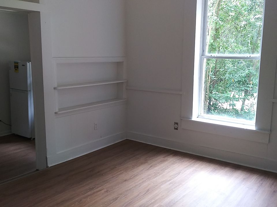 Main living space, with door to kitchen (porch entrance is behind camera)