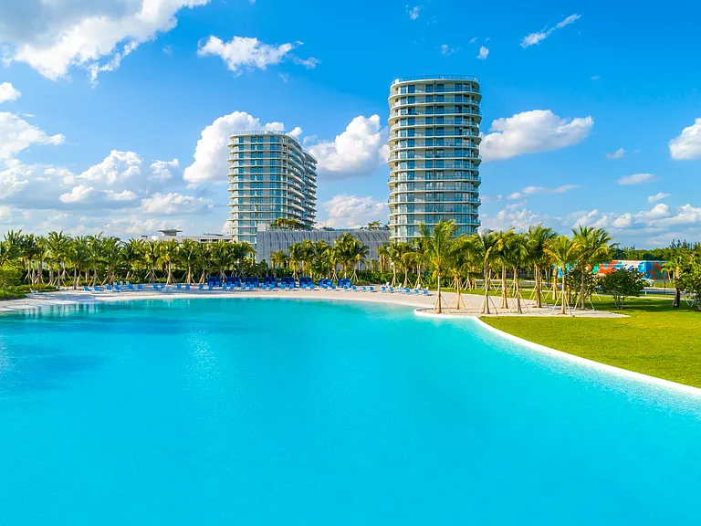 Shoreline at SoLe Mia overlooks the Laguna SoLe's lush tropical landscape.