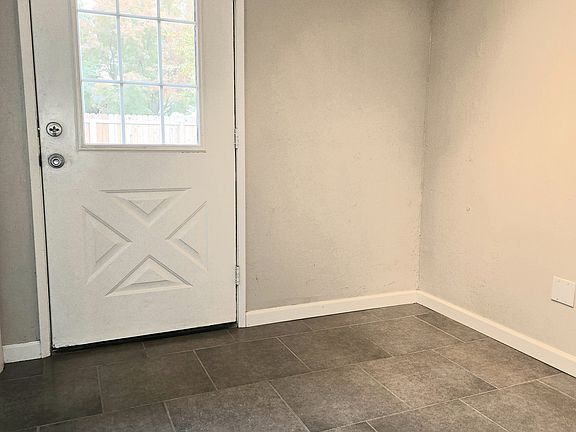 Tiled rear entry with a bonus room.