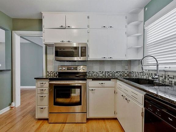 Kitchen includes range, microwave, dishwasher, refrigerator 