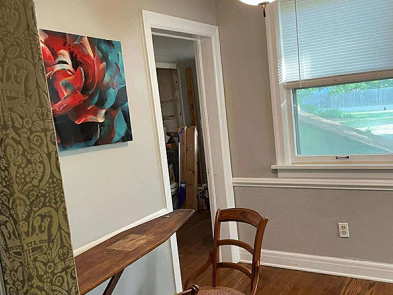 Dining nook with passthrough to the half bath and backyard/parking