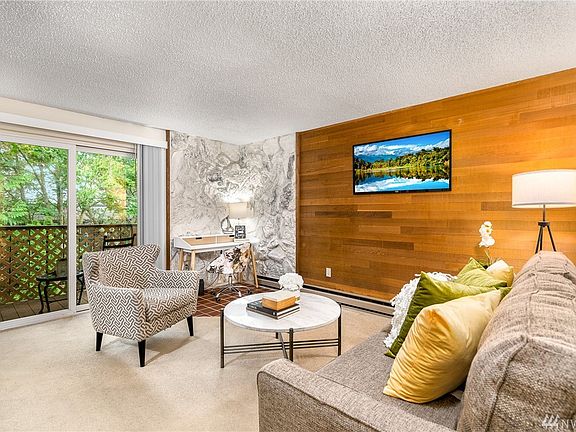 Living room with large sliding glass door for natural light.