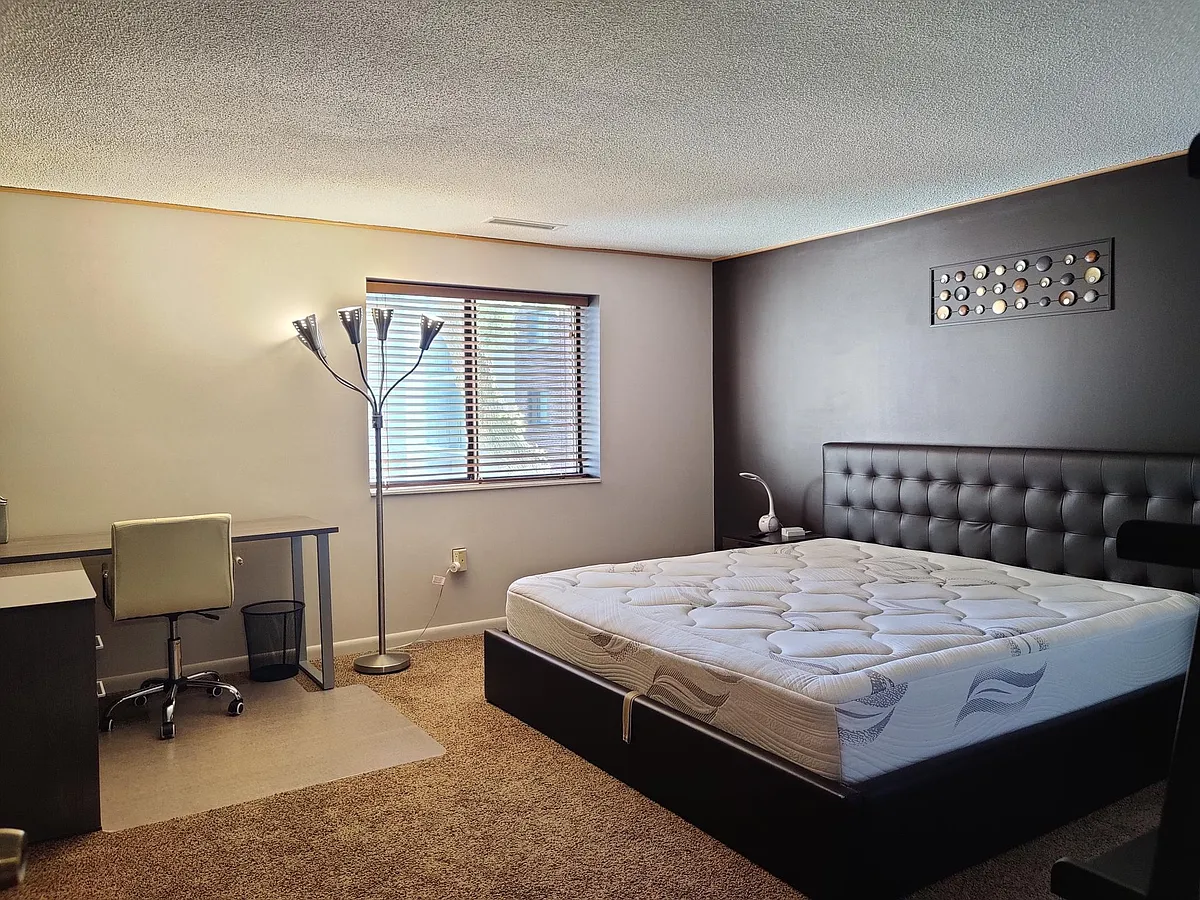 Master bedroom with king size bed. Bed has storage space underneath. - 22 9th St #205
