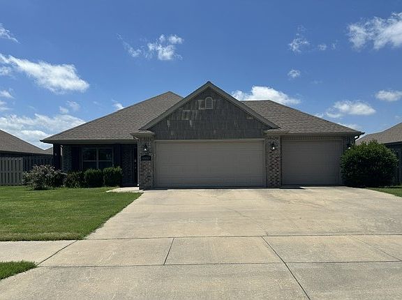 Oversized 3 car garage with extra depth and plenty of parking on the driveway.