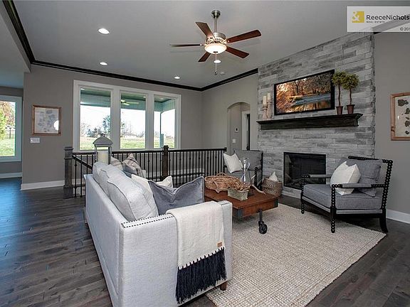 Great Room w/Hardwood Floors, Ceiling Fan & Stone Fireplace!