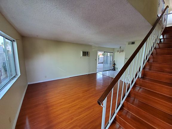 living room with view of dining area and sliding door to back patio