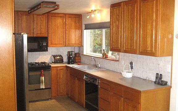 solid oak cabinets/stainless