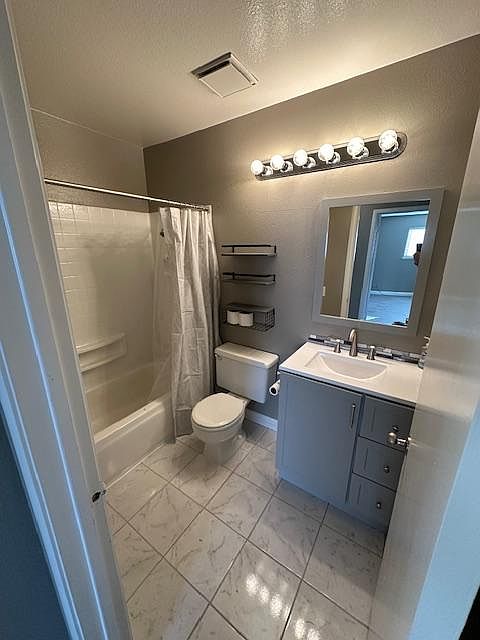 Brand new - remodeled Hallway Bath with gorgeous marble/tile floor.