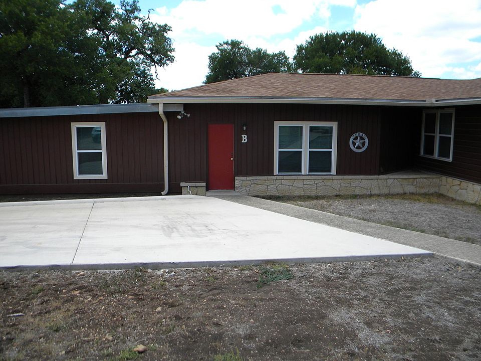 Front of duplex - 125 Oak B, with parking pad for two vehicles near front door.