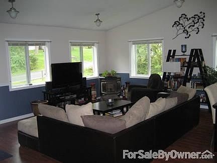 Living Room
						:
						Expansive living room with vaulted ceilings. Perfect for entertaining.