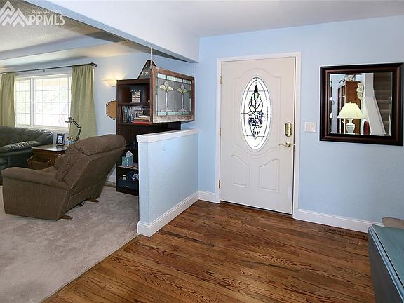 Entryway with wood flooring.
